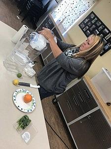 Pauline Butler, known as the water lady, prepares infused water for students at the STAR School. (Photo-Antonia Gonzales) Pauline Butler, known as the water lady, prepares infused water for students at the STAR School. (Photo-Antonia Gonzales)