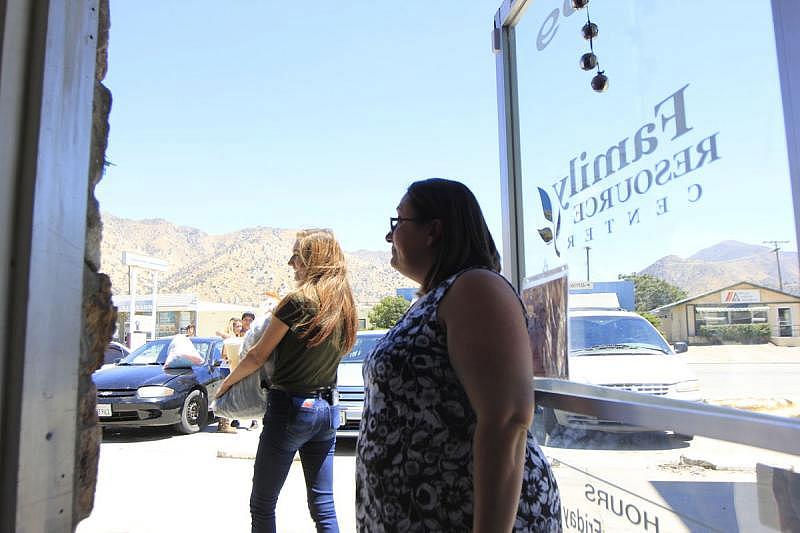 Christy Luton gifts some clothes to a few of her clients at Women's Center High Desert in Lake Isabella. Harold Pierce/The Californian Christy Luton gifts some clothes to a few of her clients at Women's Center High Desert in Lake Isabella. Harold Pierce/The Californian