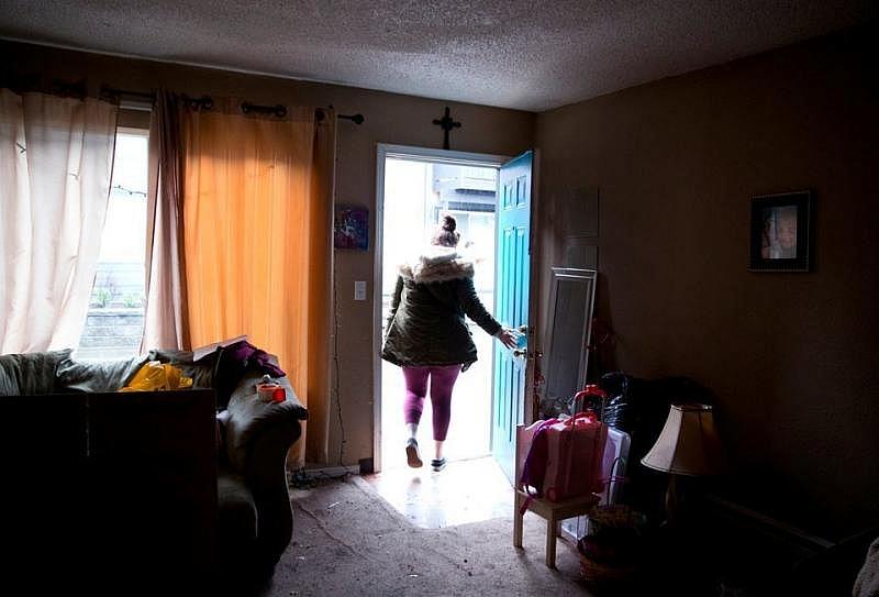 Coya Crespin exits the apartment she is in the midst of packing up in order to move. She received a no-fault eviction notice and was forced to relocate with her two children, Titan and Saraia. 
