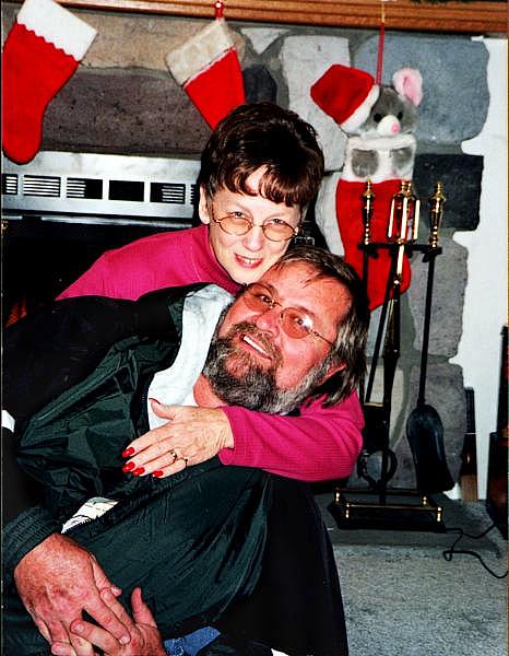 Earl "Butch" Kimmerling and his wife, Sandy hug for a picture from Christmas 1998.