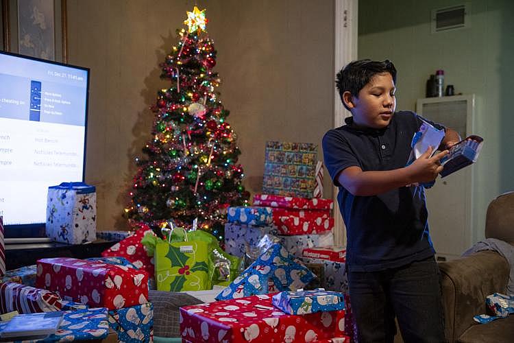 Fernando Martinez, 10, opens foam darts for a Nerf gun that was donated to him by Citizens Medical Center’s Birth Center employees. (Photo Credit: Angela Piazza/Victoria Advocate) Fernando Martinez, 10, opens foam darts for a Nerf gun that was donated to him by Citizens Medical Center’s Birth Center employees.