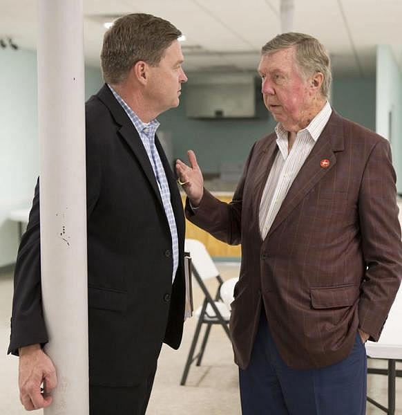 Lee County Hospital Authority attorney Jeff Mitchell (left) and Vice Chairman Ronnie Montgomery talk following a November meeting when Americore CEO Grant White said the hospital would open on time despite no visible progress. 