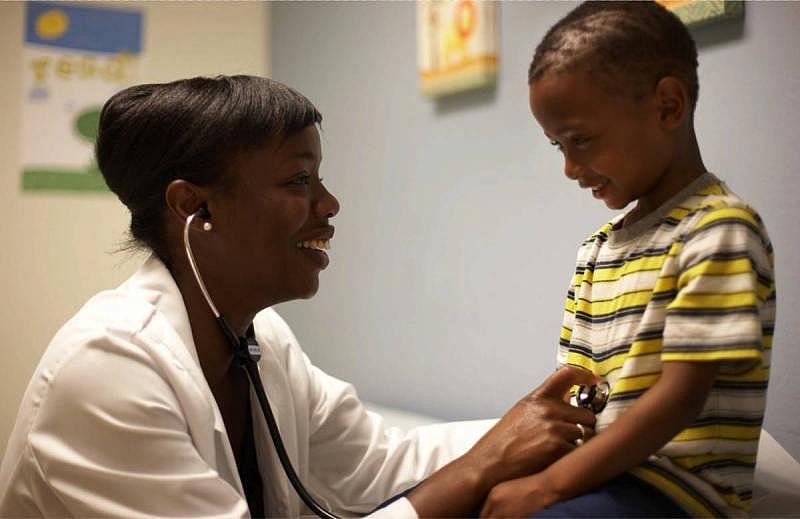 Dr. Nadine Burke Harris and a patient. (Courtesy Center for Youth Wellness)
