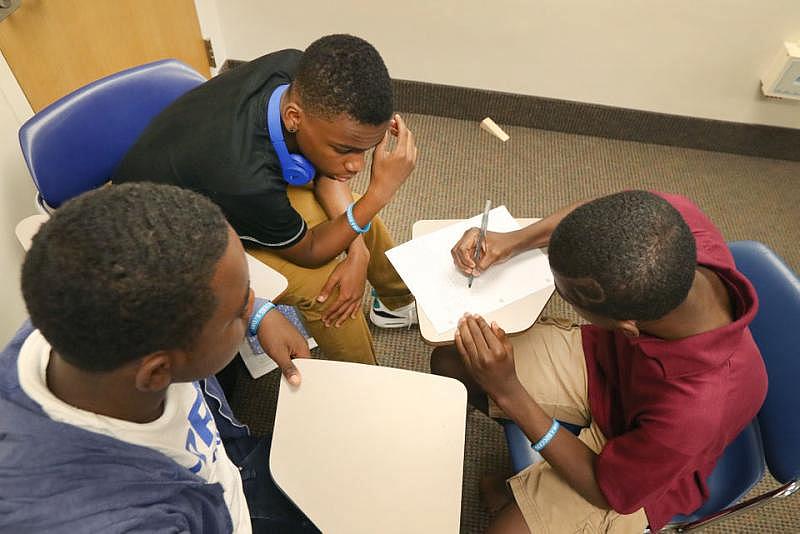 Pictured above Keion Mason, 17, works on creating a character for his short story. (Chuck Crow/The Plain Dealer)