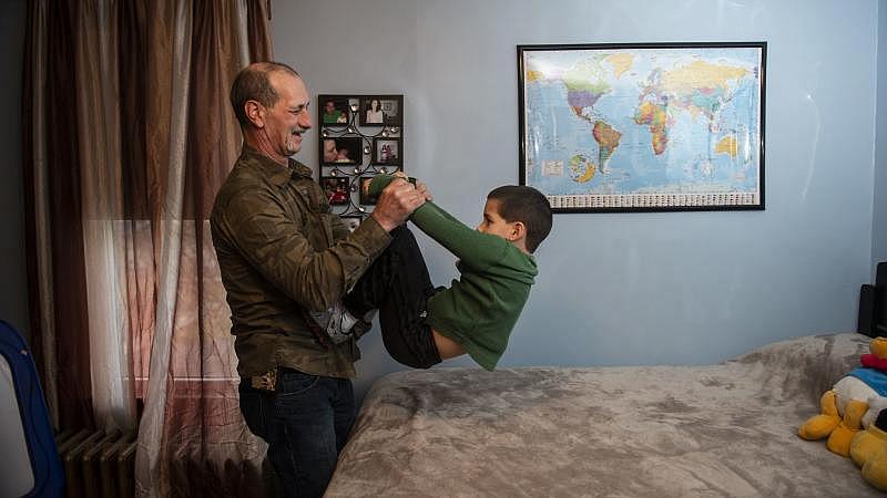 Jon Steigerwalt plays with his 7-year-old grandson Reese in the same room that was his daughter's at Kay's Palmerton home. (Photo Credit: Rick Kintzel/The Morning Call)