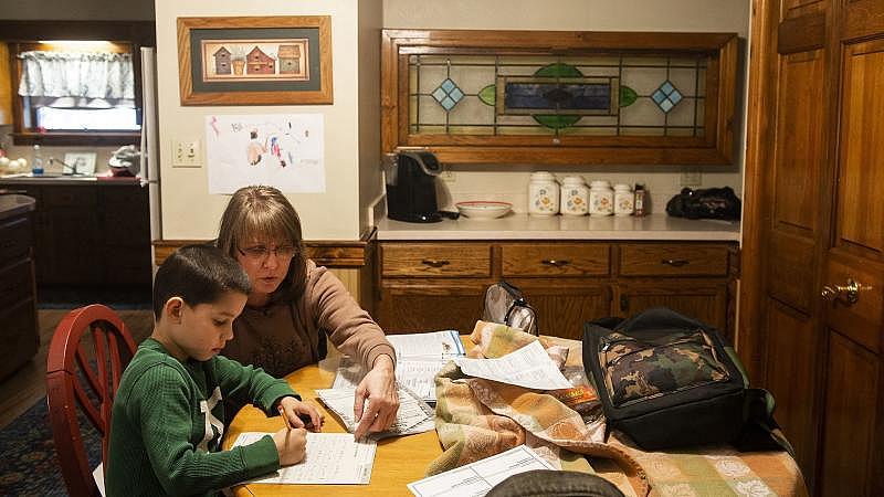 Kay Steigerwalt sits with her grandson Reese as he works on his homework. Rick Kintzel / The Morning Call