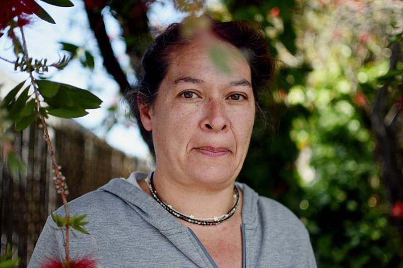 Maria Sanchez, a 16-year resident of San Rafael, California. She lives close to the San Rafael canal and is worried about sea level rise. (Lauren Hanussak/KQED)