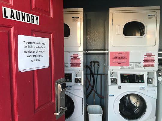 A sign on the laundry room door cautions motel H-2A guests that only two can occupy the room at a time. April 13, 2020. (Photo: Kate Cimini / The Salinas Californian)