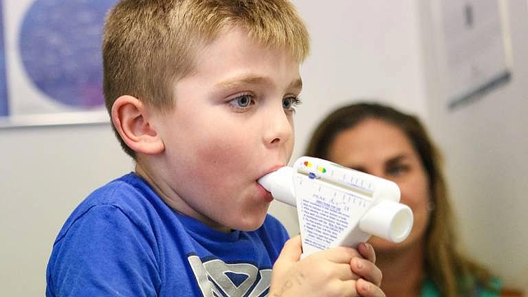 Gwynne Stump watches as her son Kagan tests his lung strength. He is being treated for asthma by Dr. William Morgan, a pediatrician in Arroyo Grande. The Nipomo family is concerned about particulate pollution in the area. David Middlecamp DMIDDLECAMP@THETRIBUNENEWS.COM