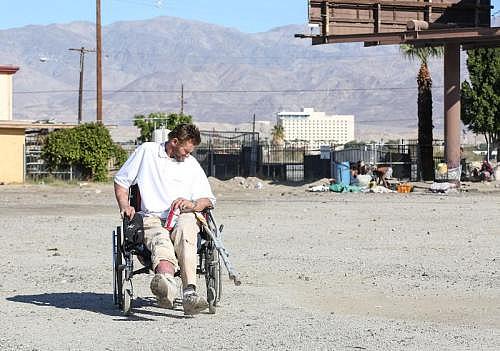 Robert Hensley pushes himself with one foot in his wheelchair. He was hit by a car three years ago. (Photo: Jay Calderon/The Desert Sun)