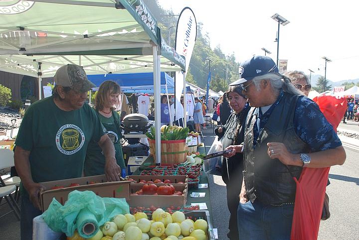 United Indian Health Services staff sell produce from their Potawot Health Village in Arcata to the Klamath Salmon Festival. Photo: Jessica Cejnar