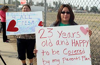 Fresno residents Blanca Gomez, in front, and Sonia Gutierrez had a message for President Obama during his visit to the Central Valley on Feb. 14.