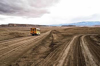  A school bus on the unpaved Indian service route 5010 near Sanostee. The seven-mile corridor connects as many as 2,500 resident