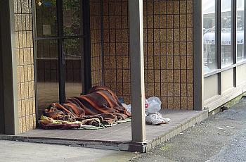 homeless individual sleeping outside