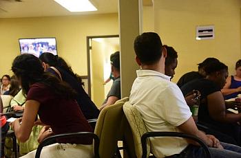 Patients awaiting their doctors appointments in the waiting room of a Livingston Community Health clinic in Livingston on Aug. 3