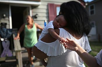 Grandmother Valencia Terrell arrives with her grandchild to stay temporarily at a friend's home on in Atlantic City. After her h