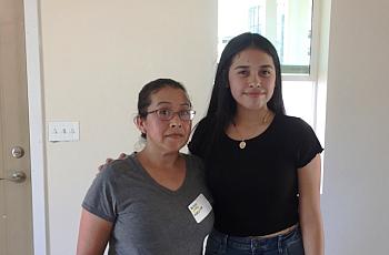 Miranda Hernandez and her mom, Adelina, stand inside their new home.