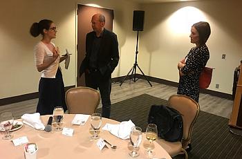 Alex Kotlowitz, center, speaks with reporters at the 2019 National Fellowship this week.