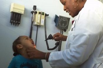 Pediatrician Porshia Mack examines 3-year-old Sania Bettancourt at Richmond LifeLong community health clinic.