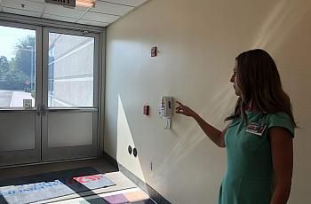 Michelle Oxford, CEO at Bakersfield Heart Hospital, shows where a gunman shot into the facility back in December of last year.
