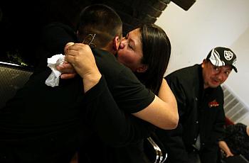 Jordan Torres, 15, hugs his mom, Tina Torres, at his graduation from Sea Mar's Renacer Youth Treatment Center in Seattle. At rig