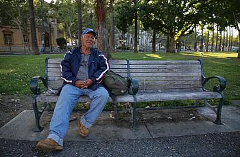 A man named Roberto sits on a bench at St. James Park in San Jose, Calif., on June 7, 2016