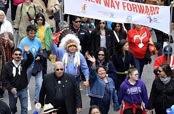 JUSTIN TANG/THE CANADIAN PRESS Truth and Reconciliation commissioner Murray Sinclair, in a black suit, marches along with Assembly of First Nations Chief Perry Bellegarde (in headdress) in an Ottawa march on Sunday that was part of the closing events of the commission's work. Between 7,000 and 10,000 participants marched. 