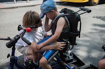 A mother comforts her son during the first annual Disability Pride Parade in 2015 in New York City.