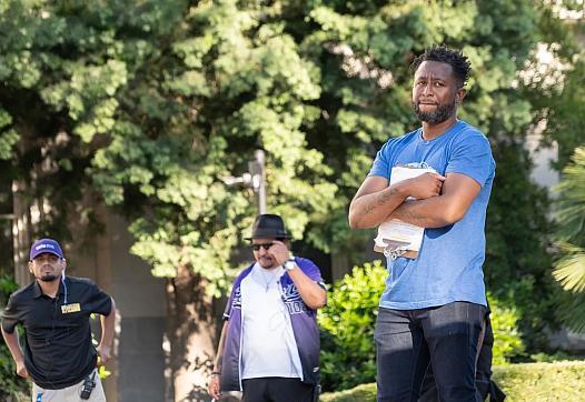 A man with others in the background