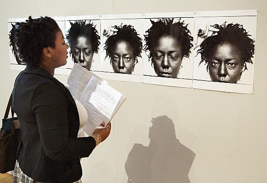 A person looking at artwork.