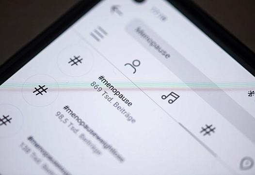 Mobile phone with social media application open on it