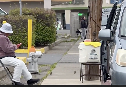 Woman sitting on street
