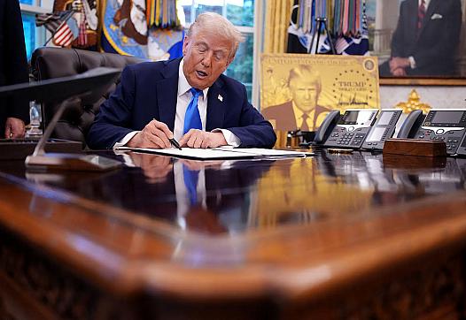 Person signing a document in office