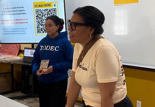 Two people standing at a podium