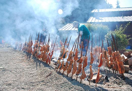 The Gensaws cook Klamath River salmon the Yurok way, on redwood sticks over an alderwood fire, at this year's Klamath Salmon Fes