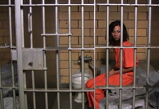 Female prisoner in cell