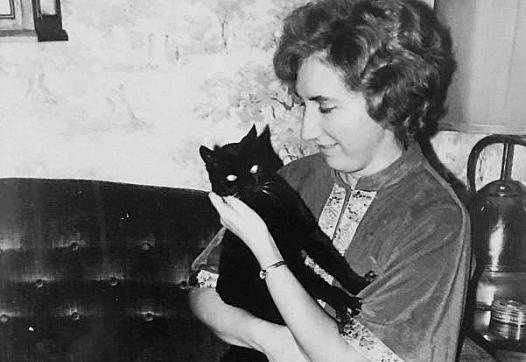 Colleen Loughman with one of her two cats, when she was a student in the 1950s at Holy Names University in Oakland. Loughman die