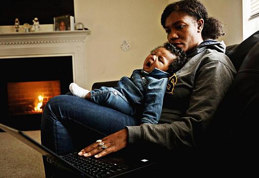 Richard yawns in mom Jessica Murrell Berryman’s lap as she works remotely from the family’s Durham home Dec. 6, 2019.
