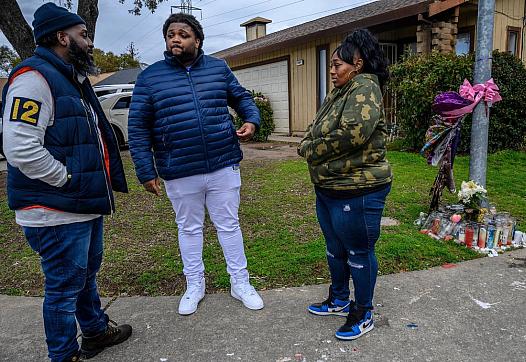 Berry Accius visits Dajha Richards’ mother and step-father near a memorial for Dajha, who was shot and killed.