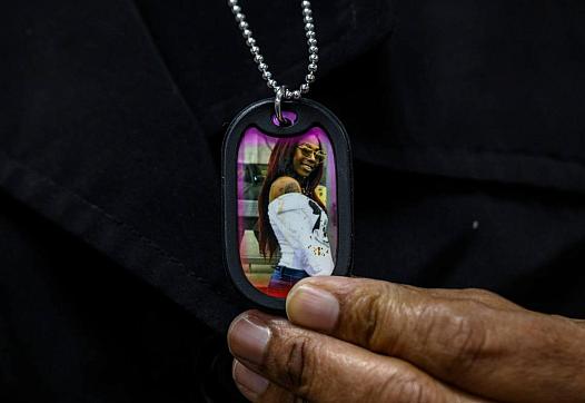 Lorrie Johnson wears a necklace with a picture of her late granddaughter Dajha Richards.