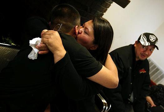 Jordan Torres, 15, hugs his mom, Tina Torres, at his graduation from Sea Mar's Renacer Youth Treatment Center in Seattle. At rig