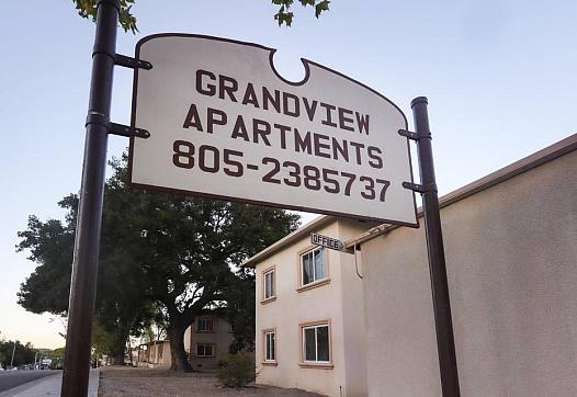 The sign that used to mark the entrance to Grand View Apartments, where hundreds of renters lived with poor conditions for years