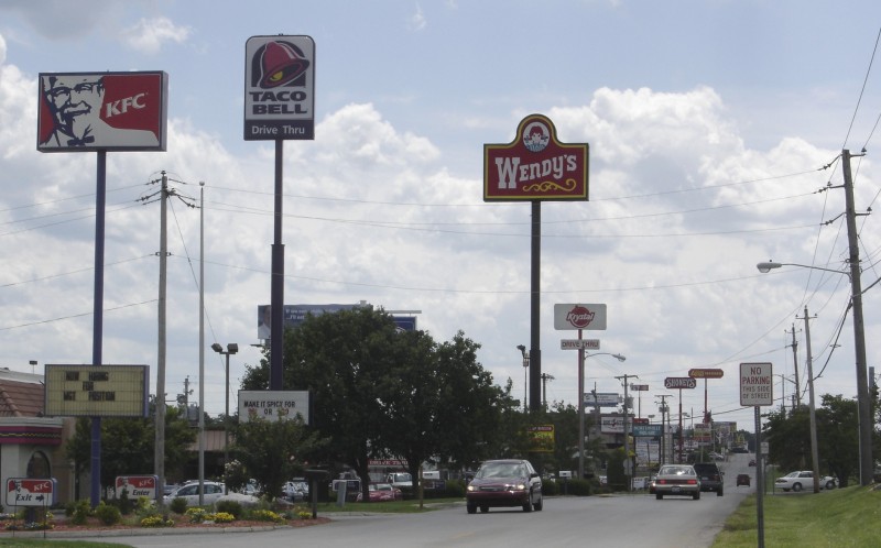 Picture of a highway in which fast food ads are featured:KFC, Wendy's and Taco Bell among others. Taken in Bowling Green, KY.